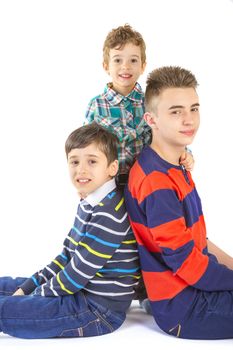 Shot studio with three brothers on white background