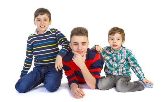 Shot studio with three brothers on white background