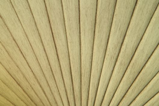 A weathered fan blade with vertically outward-moving lines