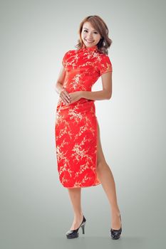 Chinese woman dress traditional cheongsam at New Year, full length portrait isolated.