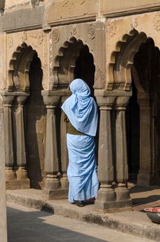 Indian woman at Chand Baori Stepwell in Jaipur, Rajasthan, India. 