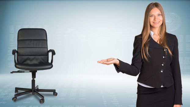 Businesswoman smiling showing something or copyspase for product or sign text. Office chair beside. Hi-tech graphs with various data as backdrop