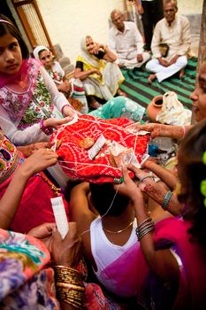 Indian groom doing marriage rituals with cross their mandap puja