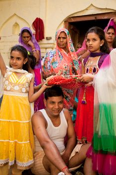 Indian groom doing marriage rituals with cross their mandap puja