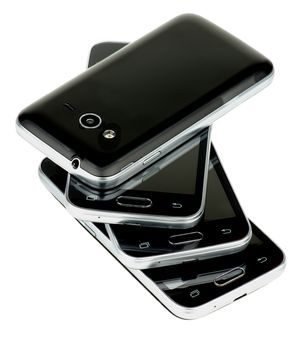 Stack of Four Contemporary Black and Silver Smartphones isolated on white background