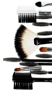 Frame of Various Make-up Brushes and Applicators closeup on white background