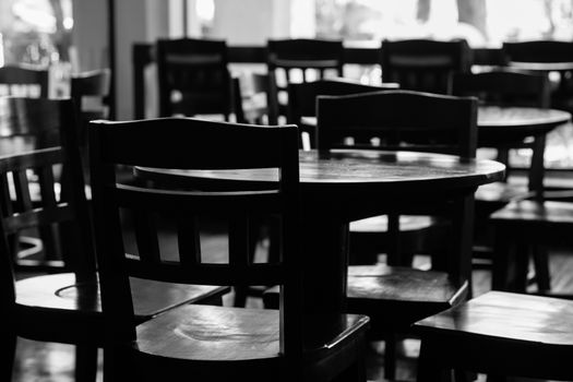 black & white of empty tables and chiar in coffee shop