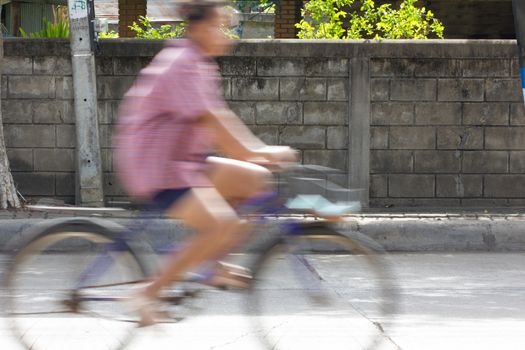 Blurred image of vehicles running on street in Thailand (motion blur image)