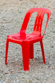 Red Chair on pebble Background