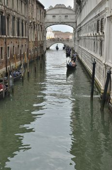 The Bridge of Sighs is a bridge located in Venice, Italy. The bridge name, given by Lord Byron in the 19th century, comes from the suggestion that prisoners would sigh at their final view of beautiful Venice through the window before being taken down to their cells. 

It connects the New Prison  to the interrogation rooms in the Doge Palace. It was designed by Antonio Contino  and was built in 1600.
