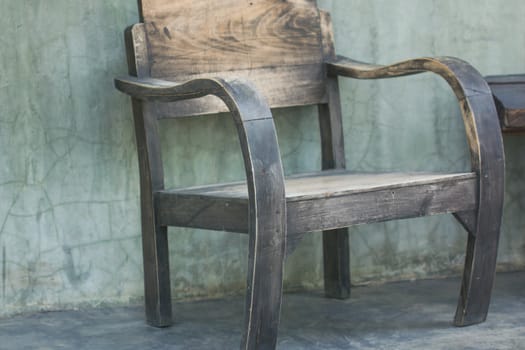wooden chair on background of grey concete