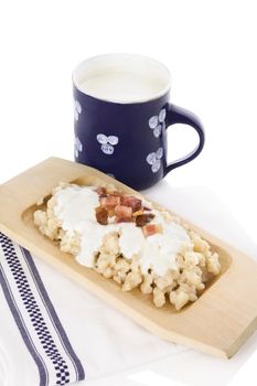 Bryndzove halusky isolated on white background. Traditional culinary slovak food. 