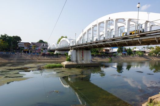 white bridge with low level river in Lampang, Thailand