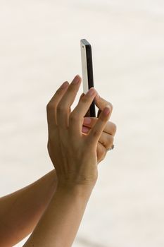 hands of female taking a picture with mobile phone
