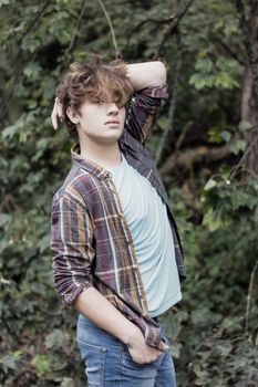 young good looking man posing in outdoor setting