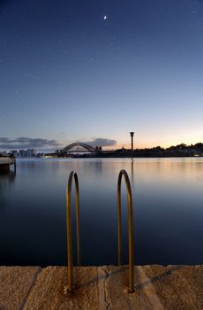 Mezzaluna over Sydney Harbour Bridge at twilight hours.