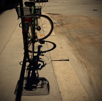 silhouette of a bike and its shadow on the streets of European cities, instagram image style