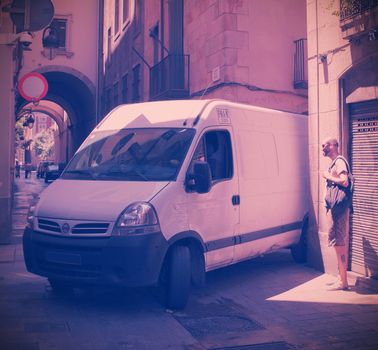 Spain, Barcelona, 06.23.2013, a scene with car on an old narrow street, instagram style filter