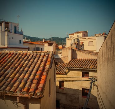 Tossa de Mar, Catalonia, Spain, 06.17.2013, roofs of houses in the old town on the Mediterranean coast, instagram image style