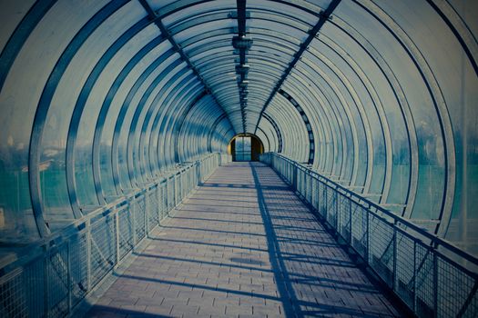 Blue modern tunnel for pedestrians above the highway, instagram image style