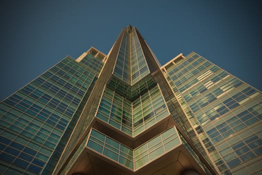 office skyscraper on a background of blue sky, instagram image style