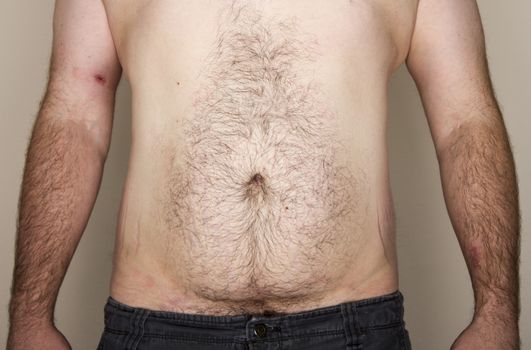 Man of normal weight of not too large but not tiny or muscular facing the camera
