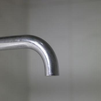 Close up of a silver tap
