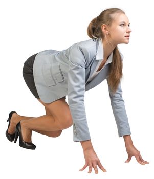Businesswoman standing in running start pose, half-turn. Isolated over white background
