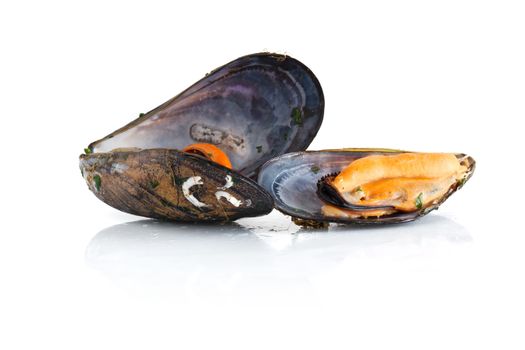 two boiled mussels with parsley isolated over white background