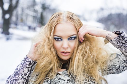 Beatifyll lady close portrait with blue eyes makeup