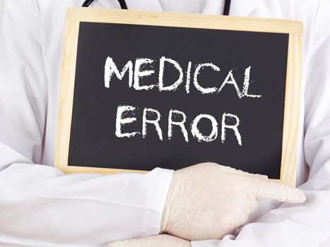 Doctor shows information on blackboard: medical error