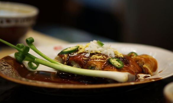 Delicious and healthy vegetarian spring rolls on table in Thai restaurant.                        