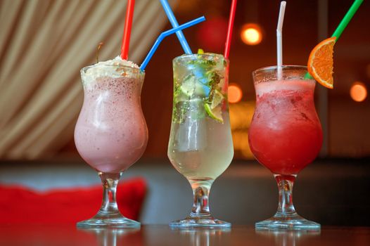 Set of three healthy nonalcoholic cocktails berries and classic mohito
