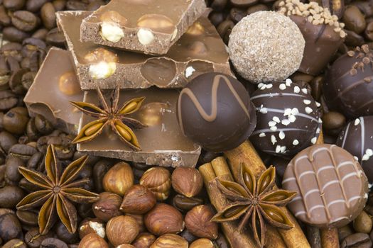 background with chocolate, coffee, spices and nuts