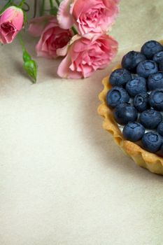 Blueberry, bilberry tart on a wooden background