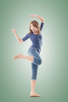 Excited Asian young girl, full length portrait isolated.