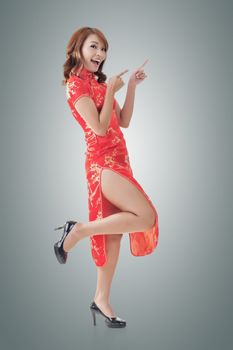 Chinese woman dress traditional cheongsam at New Year and introducing, full length portrait isolated.