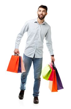 Handsome man holding shopping bags. Christmas and holidays concept