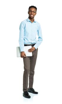 Happy african american college student standing with laptop on white background