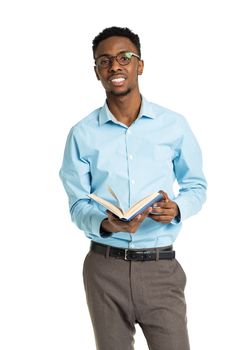 Happy african american college student standing with book on white background