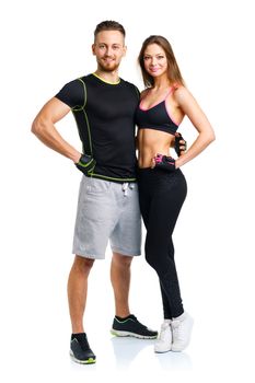 Athletic man and woman after fitness exercise on the white background