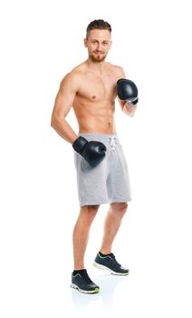 Athletic attractive man wearing boxing gloves on the white background