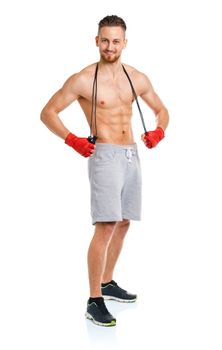 Athletic attractive man jumping on a rope on the white background