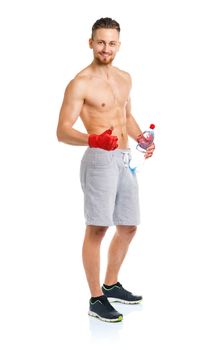 Athletic attractive man wearing boxing bandages with bottle of water on the white background