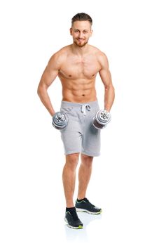 Athletic man with dumbbells on the white background