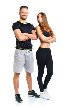 Athletic man and woman after fitness exercise on the white background