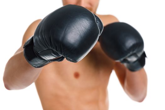 Athletic attractive man wearing boxing gloves on the white background