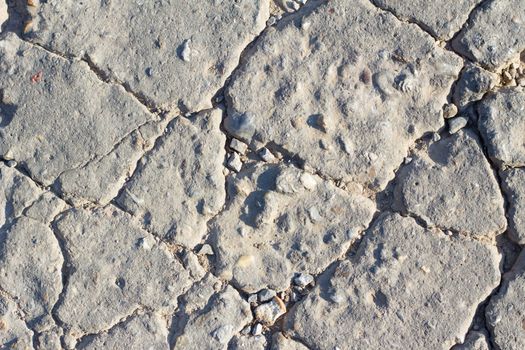 Detailed macro cracked cement road surface