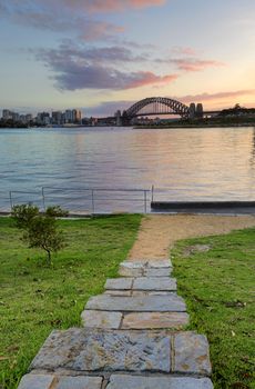 Sunrise behind the Sydney Harbour Bridge from Illoura Reserve, East Balmain, Australia