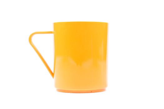 Orange plastic glass on a white background. White background with use easily.